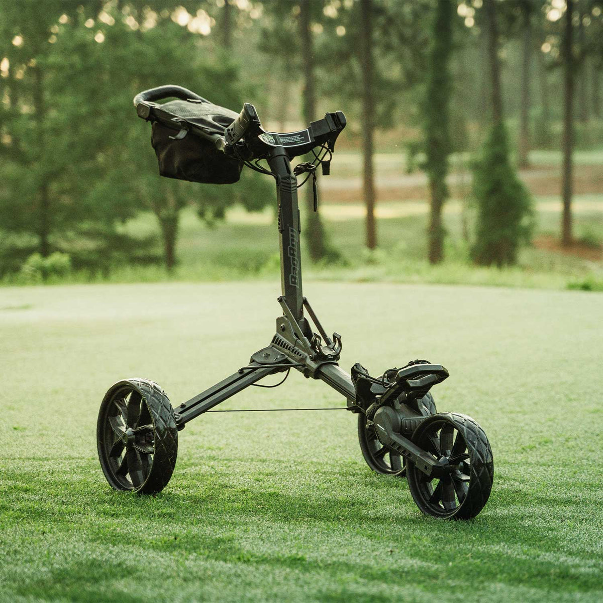 Black/Slate Bag Boy Nitron push cart fully open on the fairway