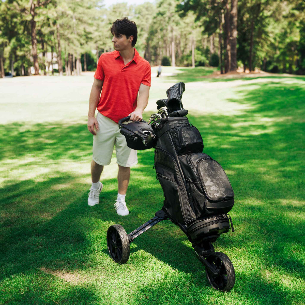 Stealth Camo LTD Bag Boy Nitron Auto-Open push cart on the golf course