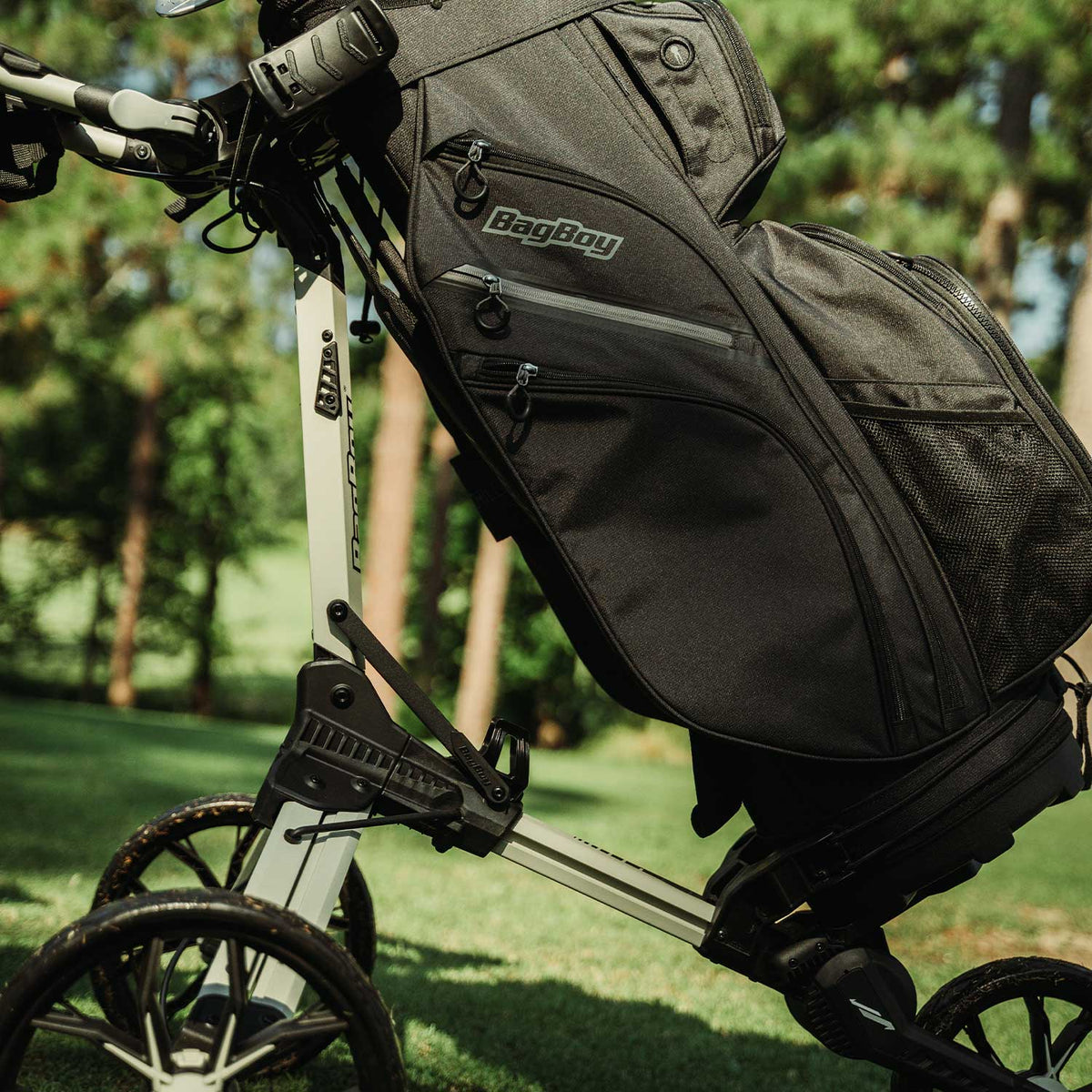 Sand/Black Bag Boy Nitron push cart frame close-up with golf bag