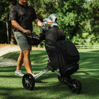 Sand/Black Bag Boy Nitron Auto-Open push cart on the golf course